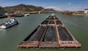 Drone photo of barges being pushed by tow boat