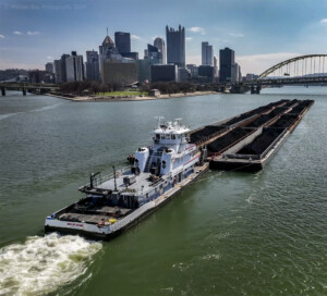 Drone photo of coal barges being pushed by the point at Pittsburgh PA