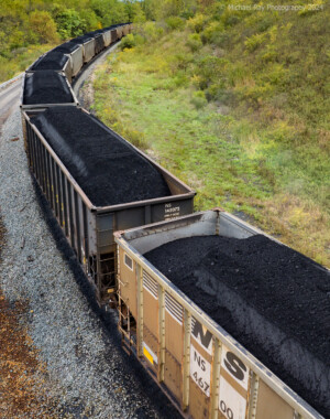 drone photo of railroad cars loaded with coal