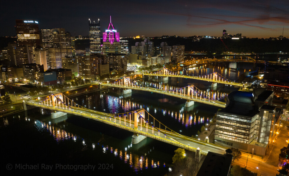 Pittsburgh's three sisters bridges, shot with a drone at night.